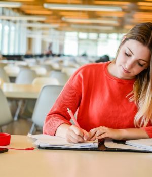 portrait-young-student-studying-university-library-education-lifestyle-concept_58466-12288